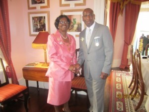 Bertram receiving the Les Pitons Medal Gold SLPM from Her Excellency Governor General in the Order of St Lucia in 2012