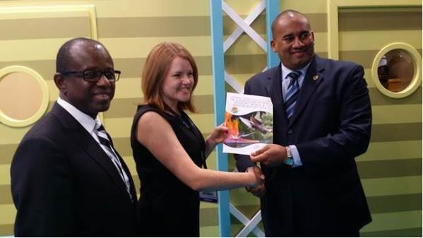 Pippa Jacks of TTG presents a copy of the European Industry Trends & Insight Report 2014 to CTO Chairman Richard Sealy with CTO SG Hugh Riley (L) looking on