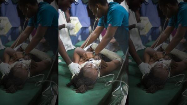 A woman who was injured during carnival celebrations is treated at the emergency room of the General Hospital in Port-au-Prince, Haiti, early Tuesday. Photo courtesy www.foxnews.com