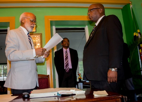 Governor General His Excellency Sir Edmund Lawrence (right) presents instrument of appointment to Prime Minister Harris. Photo courtesy ZIZ