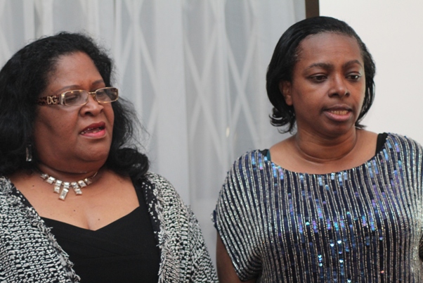 Doris with SVG High Commission colleague reciting National Anthem. Photo courtesy David F. Roberts / CaribDirect