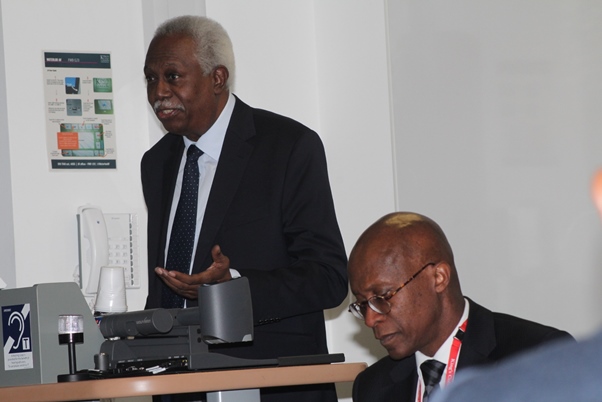Guyana High Commissioner Hamley Case at podium with Ramphal Institute director Edwin Laurent sitting. . Photo courtesy CaribDirect