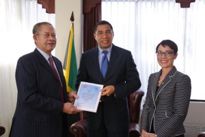 31st March 2016, Prime Minister, Andrew Holness, receiving the final report on Jamaica’s participation in the Caribbean Community CARICOM. Photo courtesy http://nationwideradiojm.com/